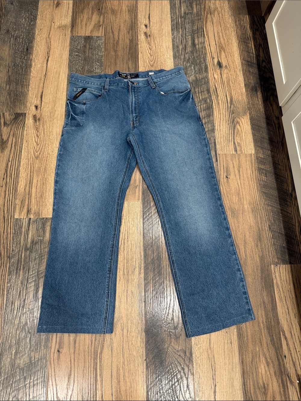 Ariat Rebar Relaxed Boot Jeans in Medium Blue Denim.